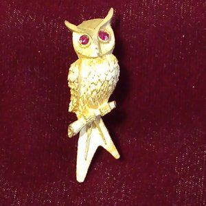 Vintage gold tone owl with ruby red eyes